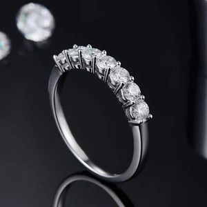 7 genuine moissanite stone .7 tcw on size 5 .925 band